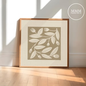 May include: A framed print of a beige background with a white stylized illustration of a leafy branch with small white flowers. The print is in a light wood frame.