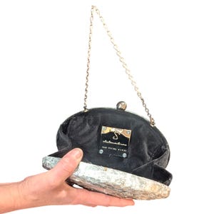 Woman Clutch Bag—Designer Bag, Handmade Bag, Statement-Fashion, Fancy Bags for Women, Women's Small Bag Clutch, Gift Her!. Bridal Clutch Bag—Mother of Peral style bag This oval-shaped hard shell clutch is not just a bag; it's a conversation starter meticulously designed to echo the breathtaking textures of the moon's landscape. Its pristine white exterior glimmers softly, capturing the light and reflecting it in a way that draws attention without saying a word. Handmade in USA. Mothers day gift