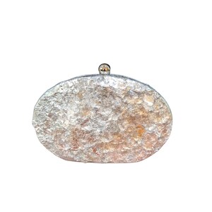 Woman Clutch Bag—Designer Bag, Handmade Bag, Statement-Fashion, Fancy Bags for Women, Women's Small Bag Clutch, Gift Her!. Bridal Clutch Bag—Mother of Peral style bag This oval-shaped hard shell clutch is not just a bag; it's a conversation starter meticulously designed to echo the breathtaking textures of the moon's landscape. Its pristine white exterior glimmers softly, capturing the light and reflecting it in a way that draws attention without saying a word. Handmade in USA. Mothers day gift