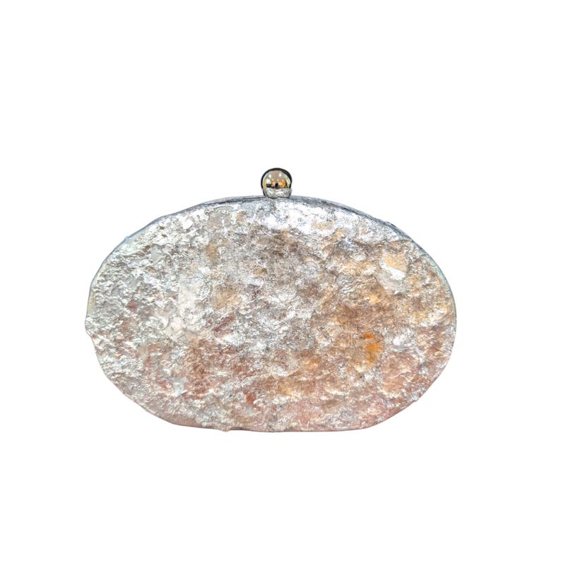 Woman Clutch Bag—Designer Bag, Handmade Bag, Statement-Fashion, Fancy Bags for Women, Women's Small Bag Clutch, Gift Her!. Bridal Clutch Bag—Mother of Peral style bag This oval-shaped hard shell clutch is not just a bag; it's a conversation starter meticulously designed to echo the breathtaking textures of the moon's landscape. Its pristine white exterior glimmers softly, capturing the light and reflecting it in a way that draws attention without saying a word. Handmade in USA. Mothers day gift