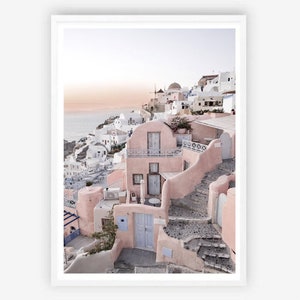 May include: A pink and white building with a stone staircase leading up to the entrance. The building is located on a hillside overlooking the ocean. The sky is a soft pink and blue.