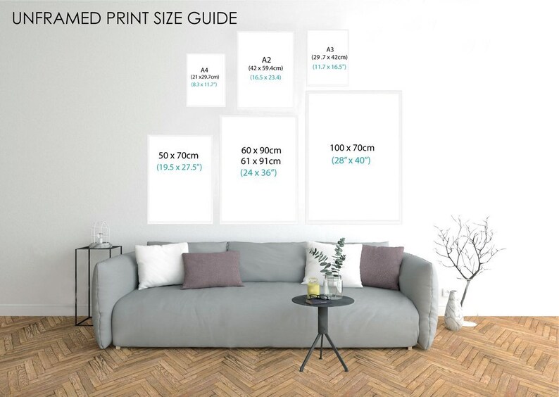 May include: A guide to unframed print sizes, showing different sizes of prints on a white wall with a gray couch and a small table in front of it. The sizes are listed in inches and centimeters. The sizes are: A4 (8.3 x 11.7 inches, 21 x 29.7 cm), A2 (16.5 x 23.4 inches, 42 x 59.4 cm), A3 (11.7 x 16.5 inches, 29.7 x 42 cm), 50 x 70 cm (19.5 x 27.5 inches), 60 x 90 cm (24 x 36 inches), and 100 x 70 cm (28 x 40 inches).
