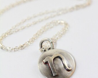 Small lowercase inital letter "n". Sterling silver disc necklace handmade by Norita Designs