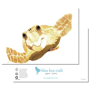 May include: Watercolor painting of a sea turtle's head, showcasing shades of tan, brown, and cream against a white background. The artwork features the turtle's eye, flipper, and shell details. The artist's name and shop name are visible in the image.