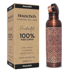 May include: A copper water bottle with an intricate floral design. The bottle is 34 ounces or 1 liter and is hand-hammered. The bottle is leak-proof and is made of 100% pure copper. The bottle is labeled "Houschefs Ayurvedic Wellness Handcrafted 100% Pure Copper".