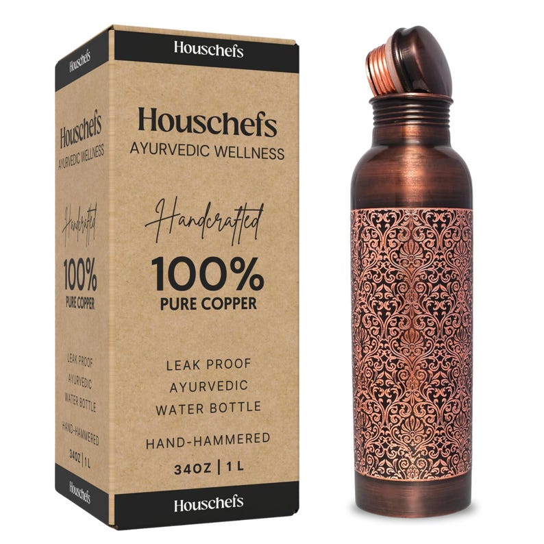 May include: A copper water bottle with an intricate floral design. The bottle is 34 ounces or 1 liter and is hand-hammered. The bottle is leak-proof and is made of 100% pure copper. The bottle is labeled "Houschefs Ayurvedic Wellness Handcrafted 100% Pure Copper".