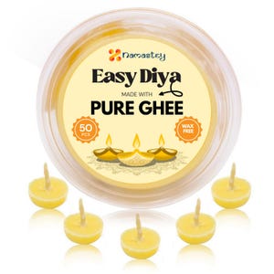May include: A container of 50 pure ghee diya candles. The container is labeled "Easy Diya Made with Pure Ghee" and "Wax Free". The diya candles are yellow and have a wick in the center.