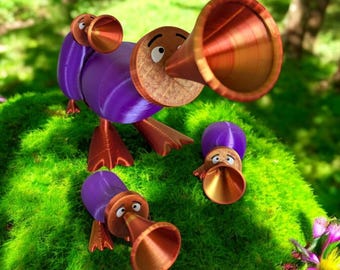 May include: Three purple and brown cartoon figures with large, red, trumpet-like mouths. The figures are standing on a bed of green moss.
