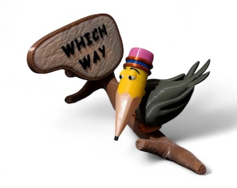 May include: A yellow pencil with a pink hat and a brown branch holding a sign that says "WHICH WAY".