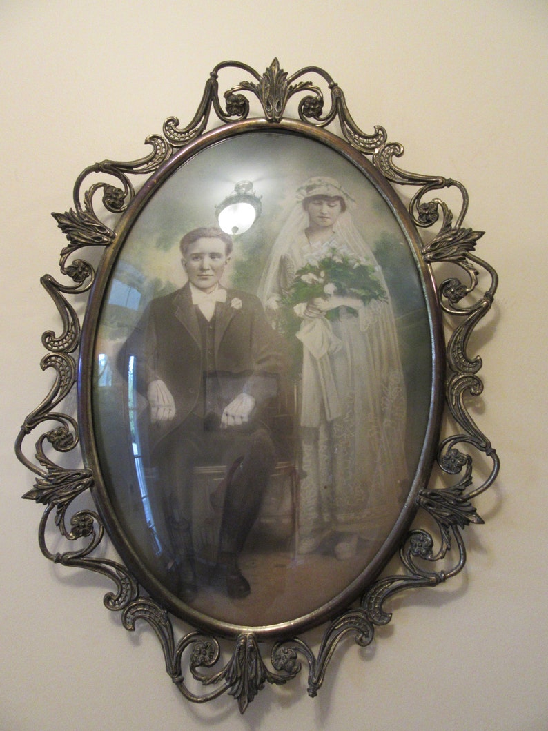 Old Metal Bubble Glass Frame With Photo Of Married Couple Image 0