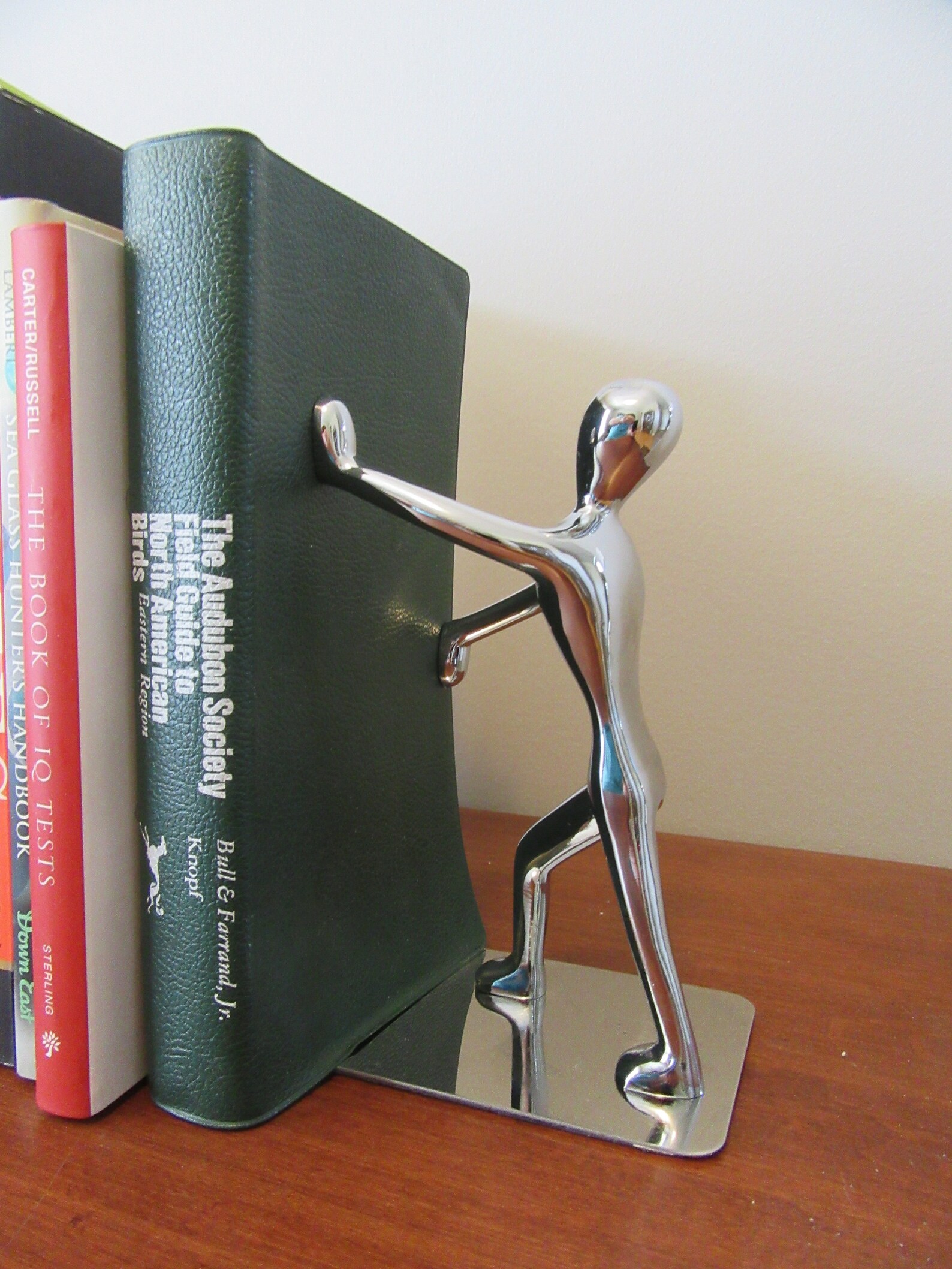 Chrome Bookshelf bookends people holding back books design Etsy