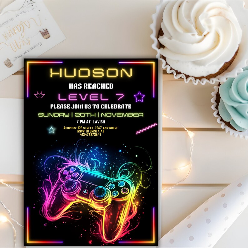 May include: A neon-colored video game controller graphic on a black background. The text "HUDSON HAS REACHED LEVEL 7" is in a neon font. The text "PLEASE JOIN US TO CELEBRATE SUNDAY | 20TH | NOVEMBER 7 PM AT LAVISH ADDRESS: 123 STREET 4567 ANYWHERE RSVP TO CRISTA AT 412476273641" is also in a neon font.