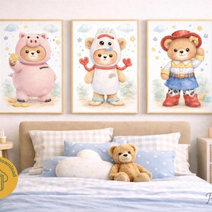 May include: Three framed watercolour prints showcasing charming teddy bears in costumes. One bear is dressed as a pig, another as a fork, and the third as a cowgirl. The prints are set against a soft, pastel background with stars and clouds.