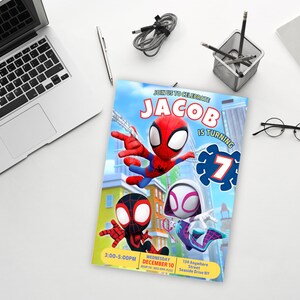 May include: A birthday invitation featuring Spider-Man and Spider-Gwen characters. The invitation is blue with a cityscape background. The text reads "Join us to celebrate Jacob is turning 7".