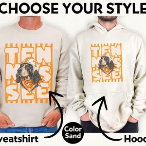 May include: A sand-coloured crewneck sweatshirt and a matching hooded sweatshirt, both featuring a graphic of a hound dog wearing a football helmet and bandana, with the text TEN SEE overlaid on orange vertical stripes and the words CHOOSE YOUR STYLE.