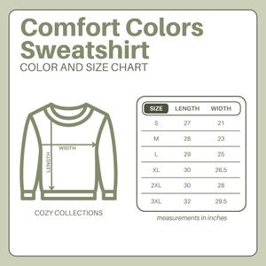 May include: A diagram of a Comfort Colors sweatshirt with a size chart. The chart shows measurements in inches for sizes S to 3XL. The text "COZY COLLECTIONS" is at the bottom.
