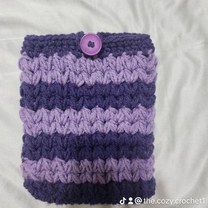 May include: Purple and lavender striped crocheted pouch with a purple button.