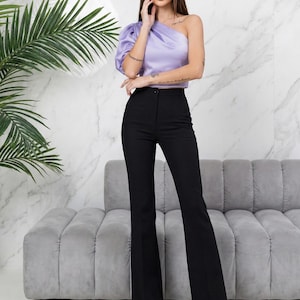 Black flared trousers fitted high rise