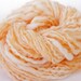Creamsicle - 84 yards hand spun Merino wool / mohair / firestar