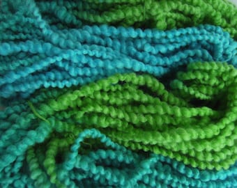 hand spun Art Yarn Super Coils Sunset over Fields Merino and Cotton.