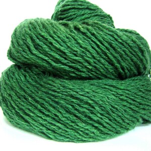 May include: A ball of dark green yarn, perfect for knitting or crocheting.