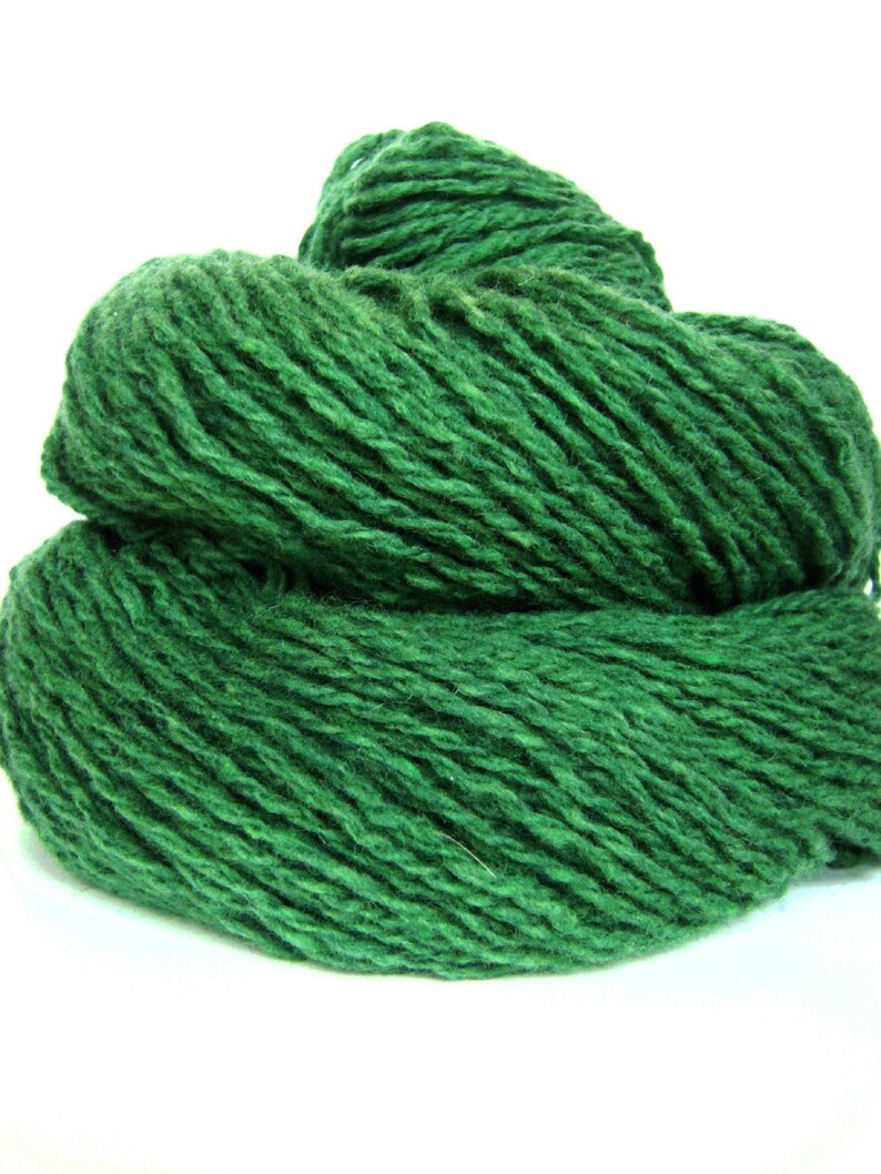 May include: A ball of dark green yarn, perfect for knitting or crocheting.