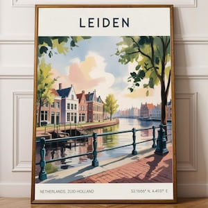 May include: A framed art print of Leiden, Netherlands, showing a canal scene with buildings, trees, and a bridge. The print includes the word "LEIDEN" at the top, with "NETHERLANDS, ZUID-HOLLAND" and coordinates at the bottom.