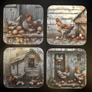 May include: A set of four square coasters with vintage illustrations of chickens, roosters, eggs, and rustic wooden structures. The coasters have a distressed appearance, with a muted colour palette of browns, whites, and creams.