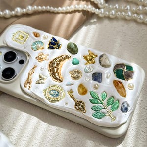 a cell phone case with a bunch of different things on it