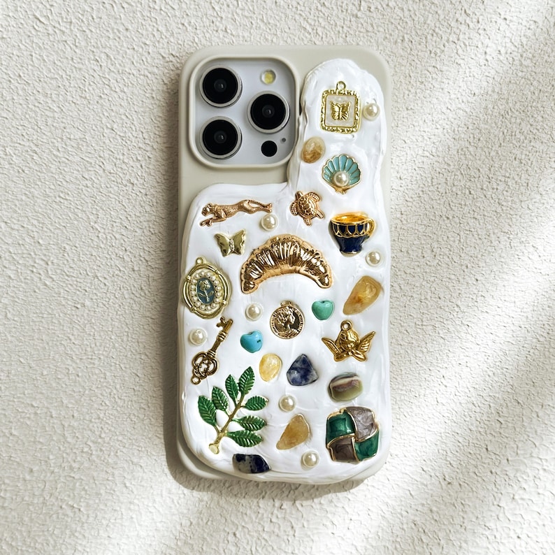 a cell phone case with a bunch of different things on it