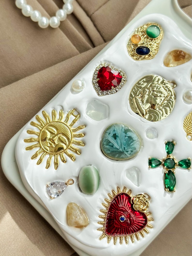 a white tray with a bunch of different jewels on it