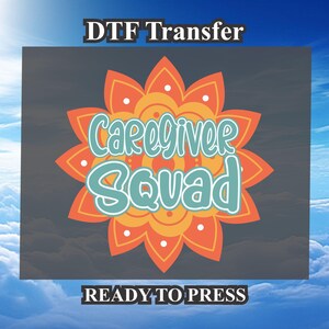 May include: A ready-to-press iron-on transfer design featuring a colorful mandala with the text "Caregiver Squad" in teal and white lettering. The design is on a dark gray background with the text "DTF Transfer" at the top and "READY TO PRESS" at the bottom.