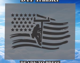 May include: A black and white silhouette of a worker climbing a utility pole, with an American flag in the background. The text "DTF Transfer" and "READY TO PRESS" is also included.