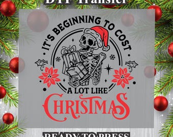 May include: A black and white illustration of a skeleton wearing a Santa hat holding presents. The text reads "It's beginning to cost a lot like Christmas".