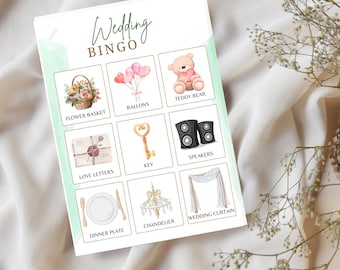 May include: A wedding bingo card with watercolor illustrations of wedding-related items. The card includes images of a flower basket, balloons, a teddy bear, love letters, a key, speakers, a dinner plate, a chandelier, and a wedding curtain. The words "Wedding Bingo" are at the top.