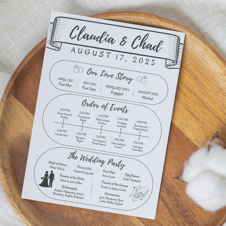 May include: A wedding timeline and party details card with the names "Claudia & Chad" and the date "August 17, 2025" printed in black on white paper. The card includes sections for the couple's love story, order of events, and wedding party.