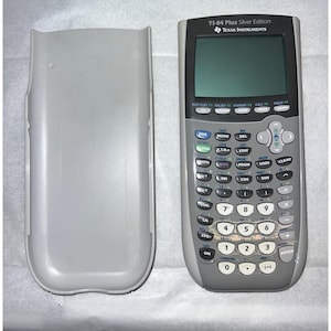 May include: A Texas Instruments TI-84 Plus Silver Edition graphing calculator with a gray and black body, a digital screen, and a full numeric and function keypad, accompanied by a separate, matching light gray protective sliding cover.