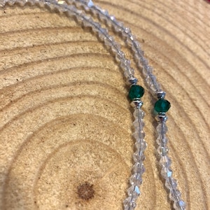 Clear crystal beaded necklace with emerald green accent beads and silver plated anchor. Use as a mask holder with easy to use lobster claws