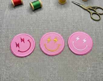 Preppy Pink Smiley Face Embroidered Patch: Lightning Bolt Design.