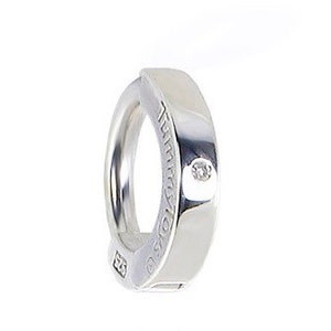May include: Silver hoop earring with a small diamond set in the front. The earring is marked with "925" and "ITALY".