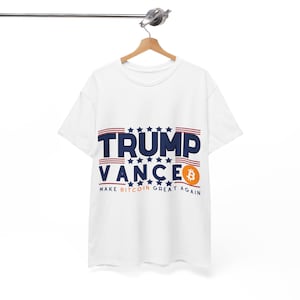 May include: White t-shirt with a blue and red American flag design and the text "Trump Vance" with a Bitcoin symbol and the text "Make Bitcoin Great Again".