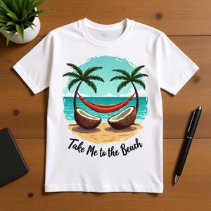 May include: White t-shirt with a beach-themed graphic. The design features palm trees, a red hammock, and coconuts on a sandy beach, with the text "Take Me to the Beach". The shirt is made of a soft material.