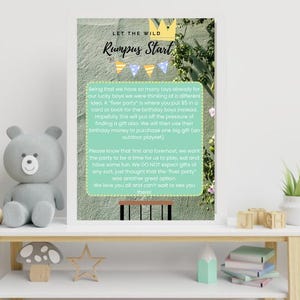 May include: A green and white printable sign with the text "Let the Wild Rumpus Start". The sign features a yellow crown and a banner with blue and white stripes. The text on the sign explains that the party is a "liver party" where guests can bring a card or book instead of a gift. The sign also mentions that the birthday money will be used to purchase one big gift.