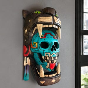 Gebarsten schedel Jaguar Warrior Maya-masker, handgemaakt, schedel, 3D, Mexicaanse kunst, Maya- en Azteekse cultuur. Houtsnijwerk