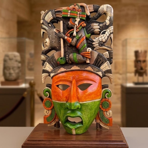 Hand-carved wood mask featuring a vibrant, bi-color face
