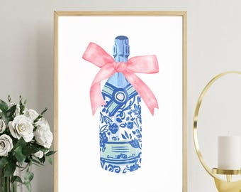 May include: A blue and white patterned champagne bottle with a pink ribbon bow. The bottle is decorated with floral and geometric designs.