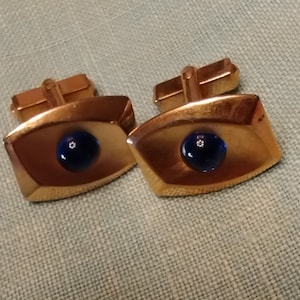 Vintage Anson Gold tone cufflinks with blue cabochon