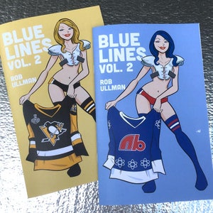 May include: Two comic book covers with a blue and yellow background. The covers feature a woman in a sports bra and short shorts holding a hockey jersey. The text on the covers reads "Blue Lines Vol. 2" and "Rob Ullman".