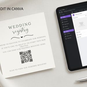 Könnte beinhalten: Eine Hochzeitsregisterkarte mit dem Text "WEDDING registry" und einem QR-Code. Die Karte enthält auch den Text "WE'RE SO EXCITED TO CELEBRATE OUR WEDDING...SCAN TO VIEW OUR WEDDING REGISTRY". Ein Tablet und ein Stift sind ebenfalls im Bild.