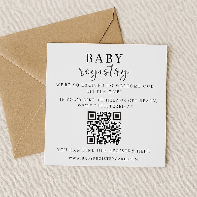 May include: A white baby registry card with black text and a QR code, placed in front of a brown envelope. The card reads "BABY registry" and includes the website www.babyregistrycard.com.